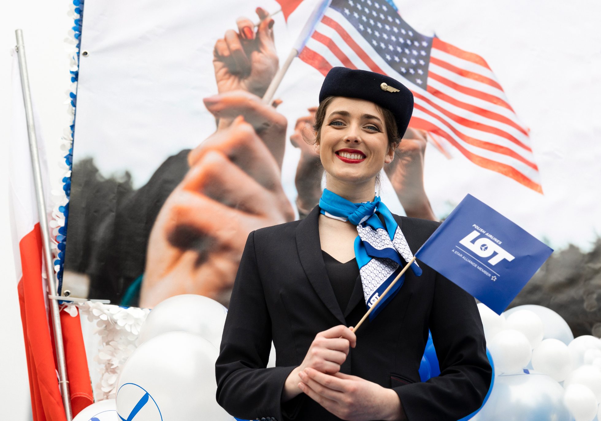 May 3 parade in Chicago - LOT flight attendant in parade holding LOT flag